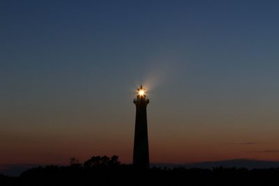 Silhouette tower against clear sky at sunset