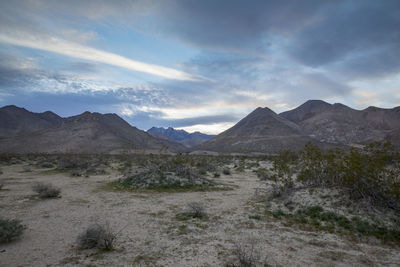 View of mountain range against cloudy sky