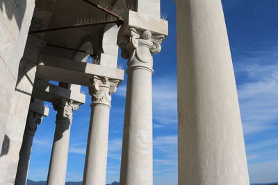 Low angle view of mosque against blue sky