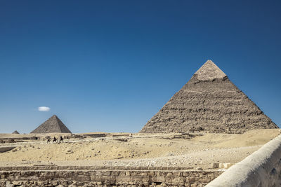 Stupas against clear blue sky