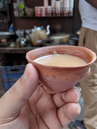 Close-up of hand holding drink