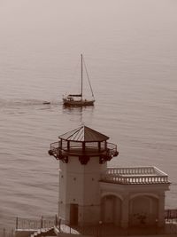 Sailboat in sea against sky