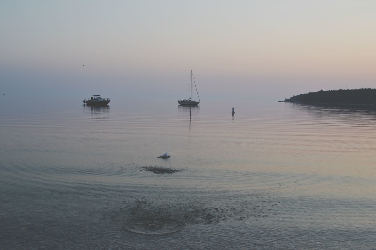 sea, water, sunset, nautical vessel, transportation, mode of transport, boat, tranquil scene, horizon over water, tranquility, scenics, waterfront, beauty in nature, nature, sky, copy space, idyllic, moored, reflection, beach