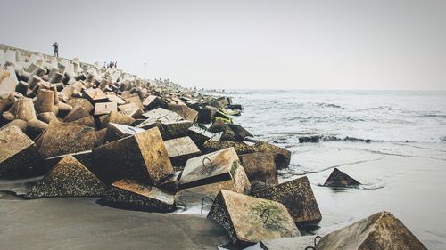 Low angle view of concrete block on coastline