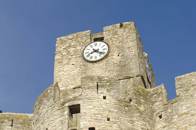 Old clock church in saint-laurent-des-arbres, france