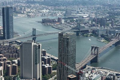 High angle view of bridge and buildings in city