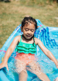 Happy girl in swimming pool