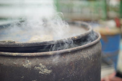 Close-up of smoke emitting from container