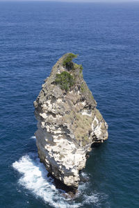 High angle view of rock formation in sea