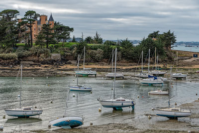 Boats moored at harbor