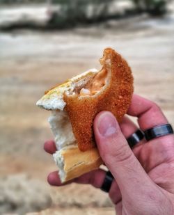 Close-up of hand holding bread