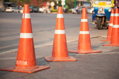 Traffic cones in row on city street
