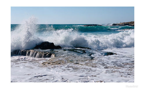 Waves splashing on shore