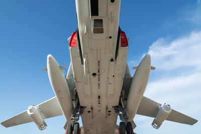 Combat aircraft fighter bomber on a blue sky background