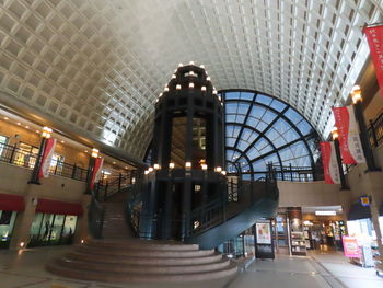 Low angle view of illuminated shopping mall