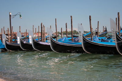 Boats moored in canal