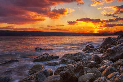 Scenic view of sea against sky during sunset