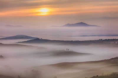 Scenic view of mountains against sky during sunset