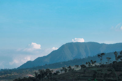 Scenic view of landscape and mountains against sky