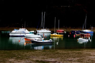 Boats moored in sea