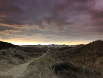 Scenic view of field against sky during sunset