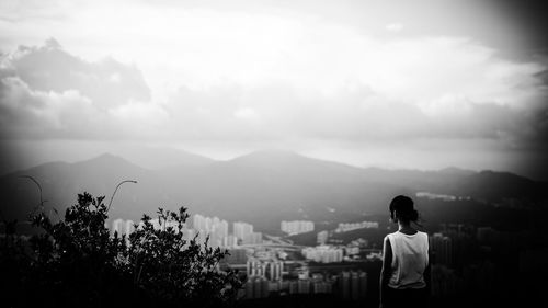 Scenic view of mountains against cloudy sky