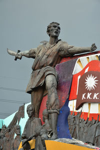 Low angle view of statue against the sky