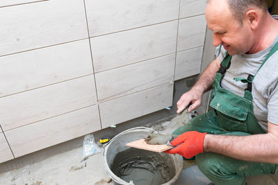 Side view of man working at home