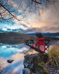 Scenic view of lake against sky during sunset