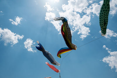 Low angle view of birds flying in sky