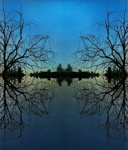 Reflection of trees in lake against sky