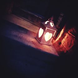 High angle view of illuminated lamp on table