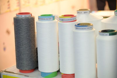 Close-up of thread spools on table