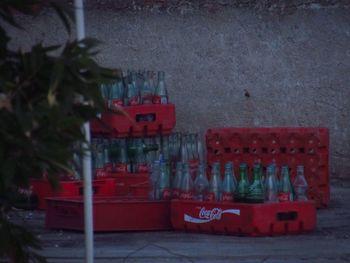 Close-up of red wine bottles on table