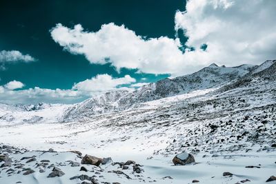 Scenic view of snowcapped mountains against sky