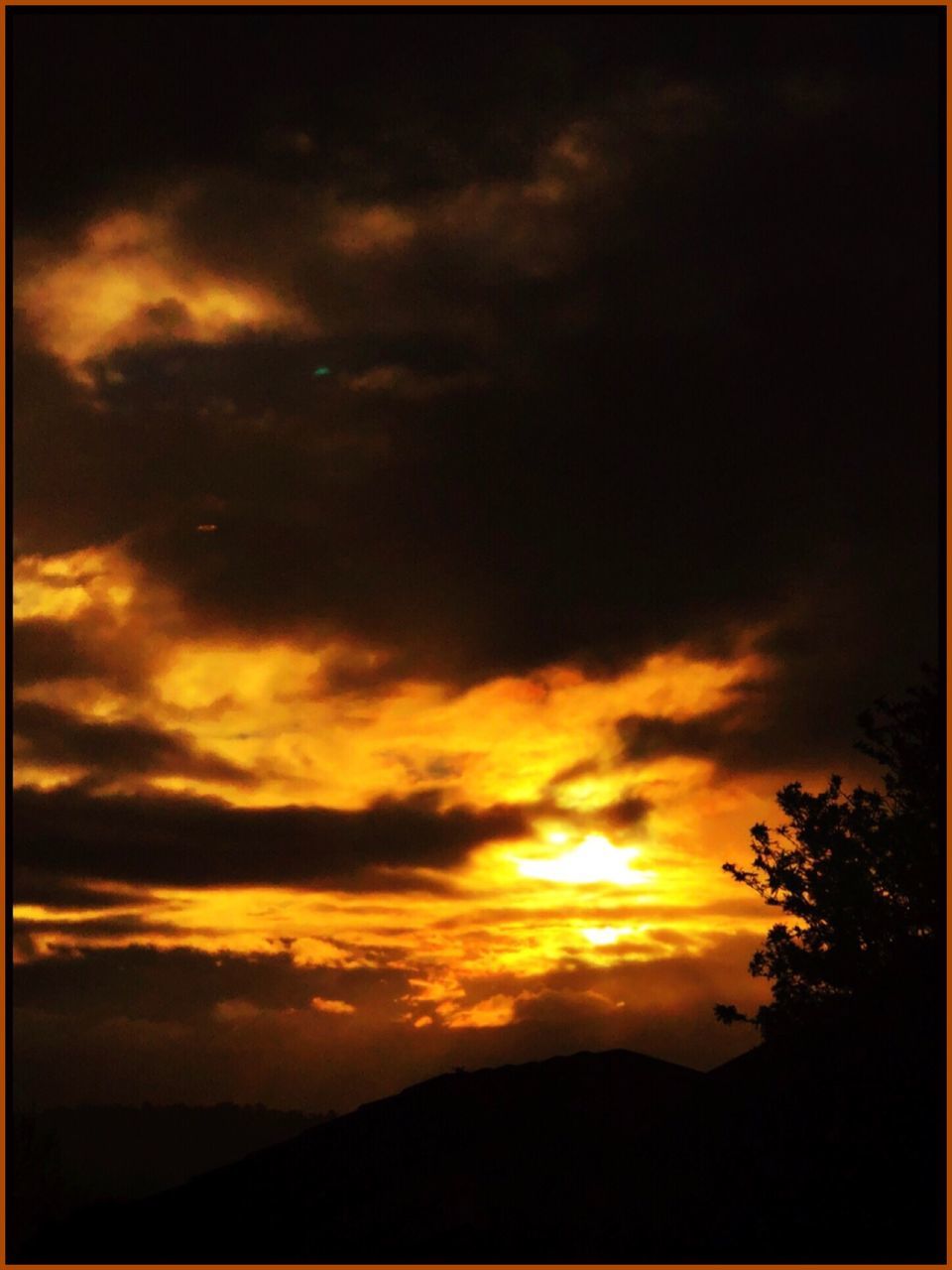 sky, cloud - sky, sunset, beauty in nature, scenics - nature, silhouette, tranquility, tranquil scene, orange color, no people, nature, idyllic, tree, transfer print, dramatic sky, plant, auto post production filter, outdoors, low angle view, awe