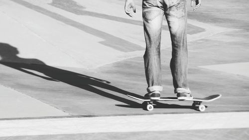 Low section of man standing on street