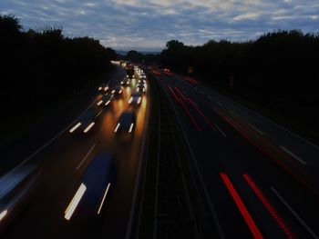 High angle view of light trails on road at night