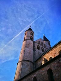 Low angle view of tower against blue sky