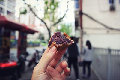 Close-up of hand holding ice cream