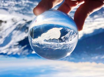 Close-up of person holding crystal ball