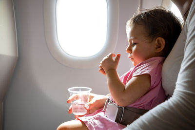 Boy sitting in airplane