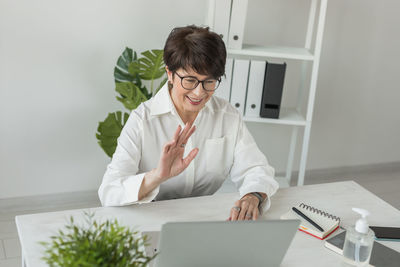 Young woman using digital tablet at home