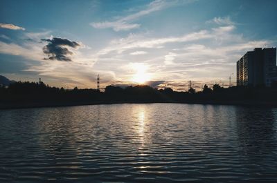 Scenic view of lake against sky during sunset