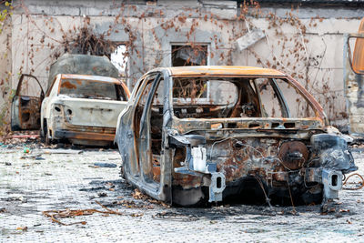 Abandoned car on field