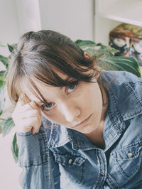 Close-up portrait of a young woman looking away