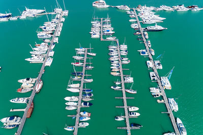 High angle view of sailboats moored in sea