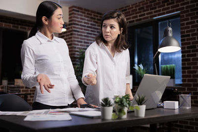 Portrait of smiling businesswoman working at office