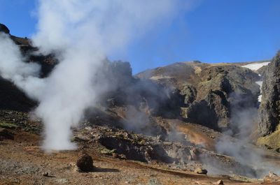 Steam rising from geothermal fumaroles in hveragerdi icelands volcanic region.