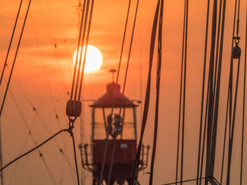 Lifeboat against sky during sunset